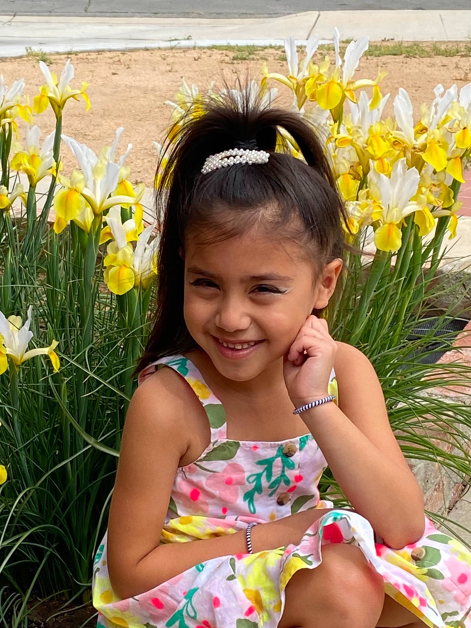 Stella is registered to the contest to win money with this photo: black_hair, botany, eye, facial_expression, flower, fun, grass, hairstyle, happy, head, iris, joy, nature, organ, people_in_nature, person, petal, photograph, plant, smile