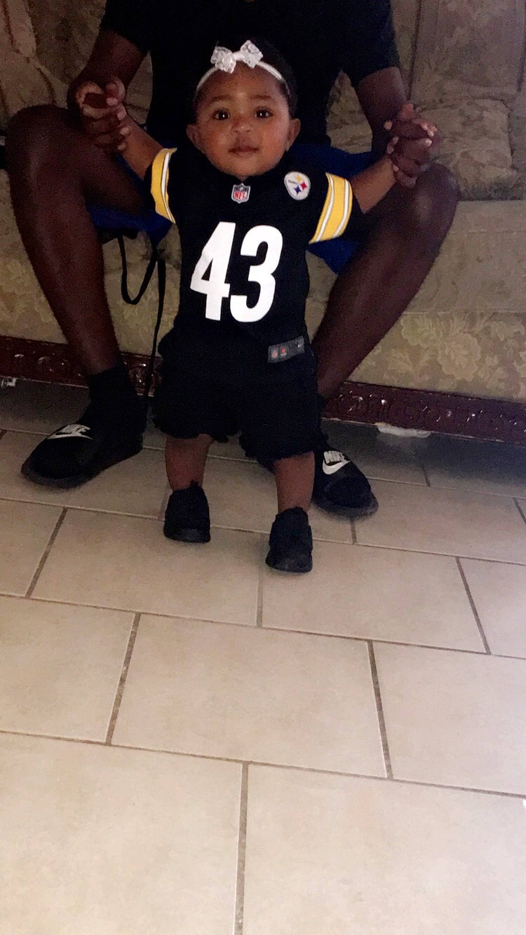 Zyanna Hill is registered to the contest to win money with this photo: clothing, day, finger, floor, flooring, footwear, fun, girl, headgear, human_body, joint, leg, muscle, person, personal_protective_equipment, product, recreation, shoe, t_shirt, thigh