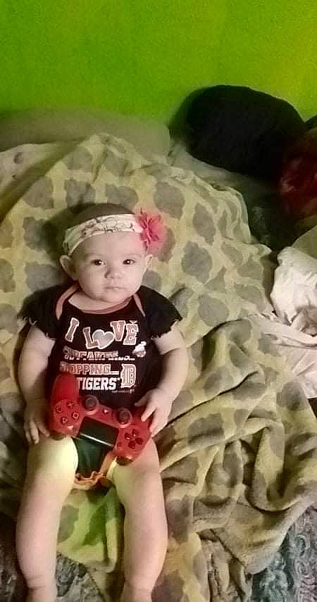 Amalia joined the competition — help win amazing prizes! baby, baby_products, baby_toddler_clothing, chair, child, comfort, fashion_accessory, fun, happy, headwear, human_leg, knee, linens, pattern, person, play, shorts, sitting, sleeve, t_shirt