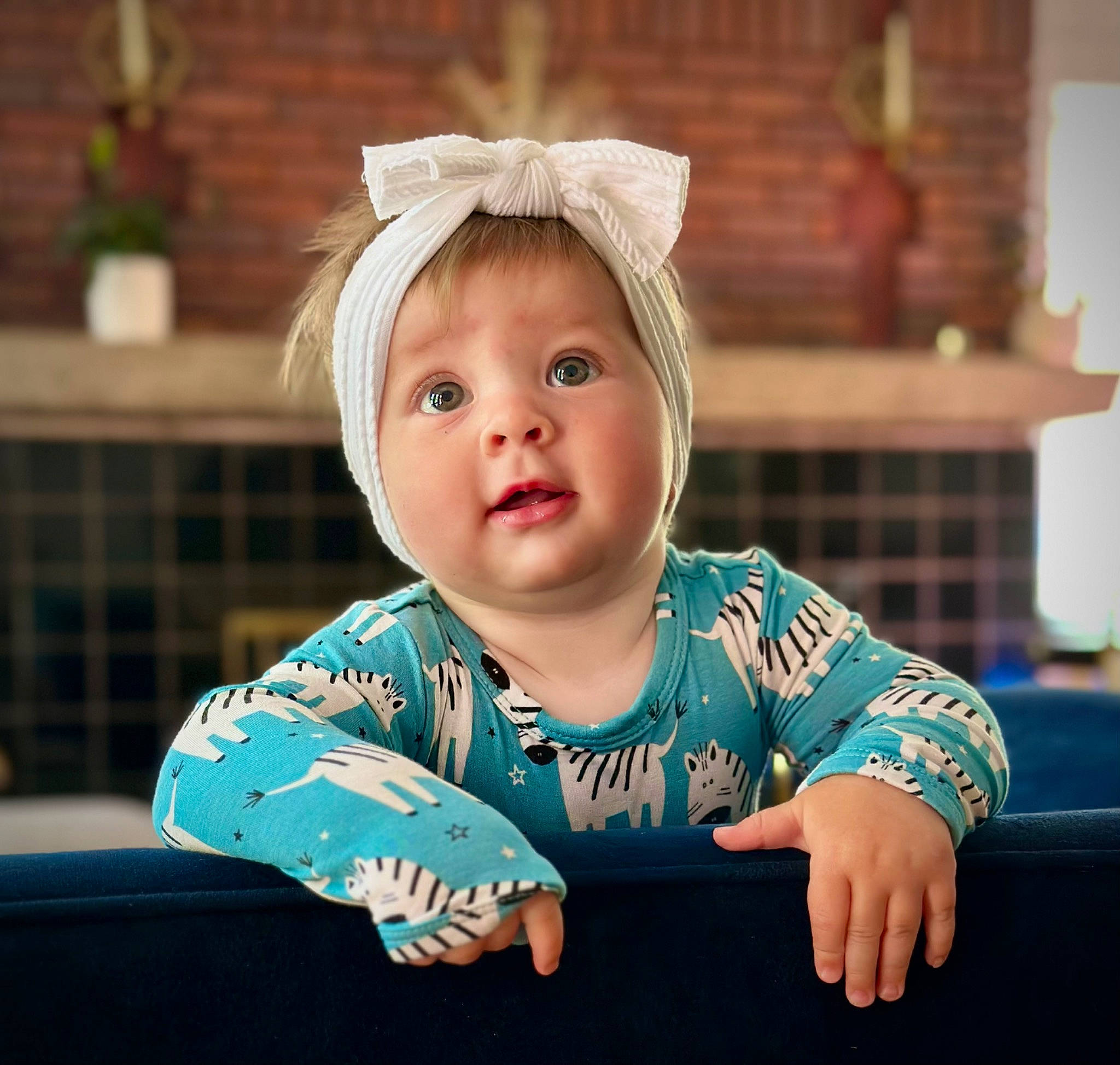 Lyla is registered to the contest to win money with this photo: baby, baby_toddler_clothing, cheek, child, fashion_accessory, flash_photography, fun, grass, happy, human_body, iris, lip, person, portrait_photography, room, sitting, skin, sleeve, t_shirt, toddler