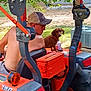Copper James joined the competition — help win amazing prizes! man, dog, tractor, outdoor, cap, shirtless, grass, tree, machine, vehicle, pet, brown_dog, summer, sunlight, rural, agriculture, farm, equipment, person, leisure