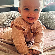 Emmie-Rose joined the competition — help win amazing prizes! baby, child, infant, smiling, pink_bow, polka_dot, bed, blanket, soft, cute, happy, indoors, clothing, long_sleeve, headband, portrait, playful, hands, face, cozy
