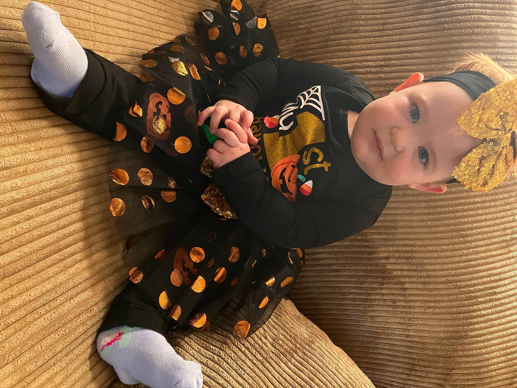 Annabeth joined the competition — help win amazing prizes! baby, baby_toddler_clothing, child, comfort, costume, costume_hat, fashion_accessory, flooring, fur, gesture, hat, headgear, pattern, person, room, sitting, sleeve, textile, toddler, wood