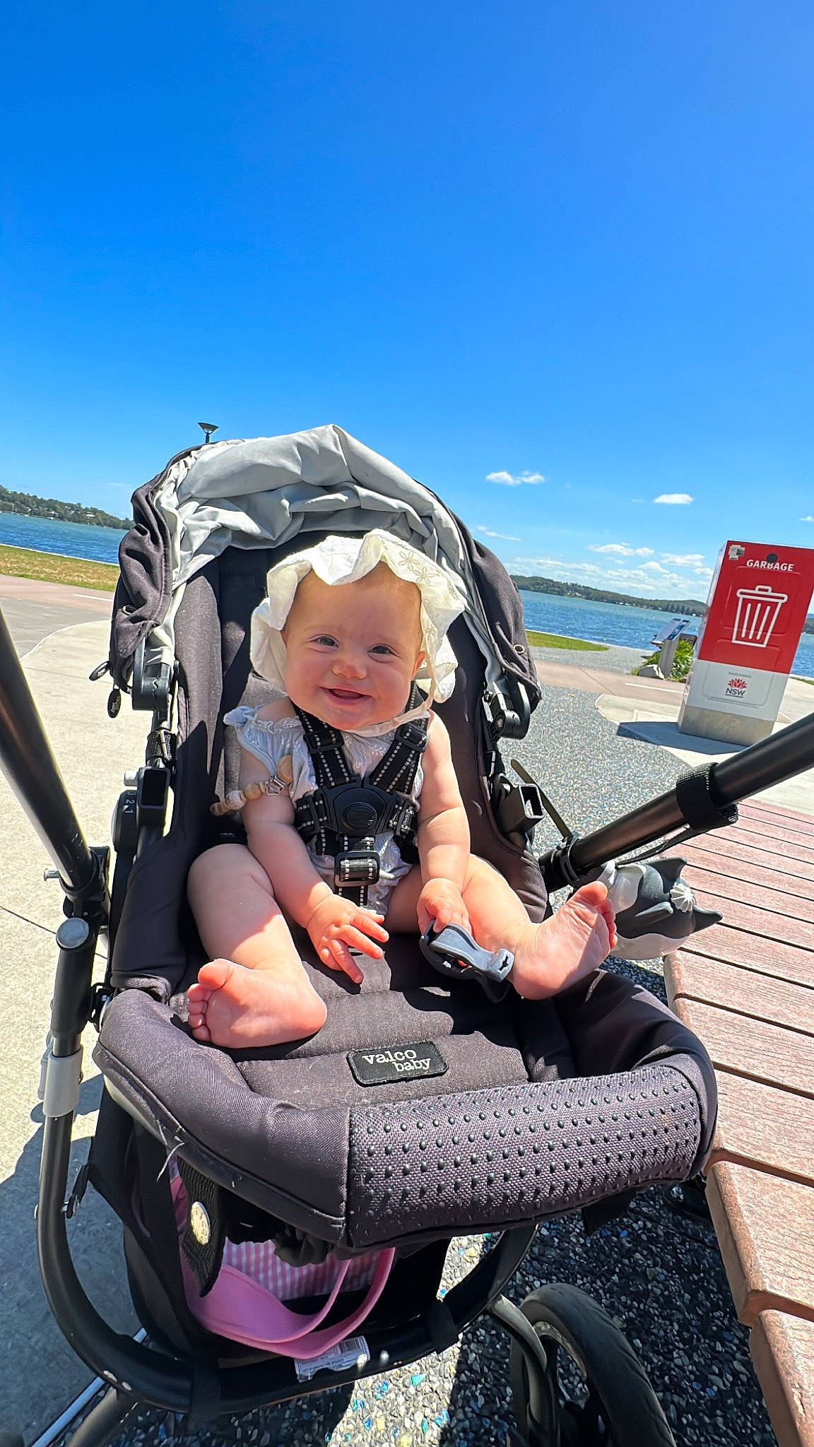 Alexia is registered to the contest to win money with this photo: auto_part, automotive_tire, baby, baby_carriage, baby_products, cloud, comfort, fun, headwear, lap, leisure, person, personal_protective_equipment, recreation, sitting, sky, smile, tire, toddler, travel