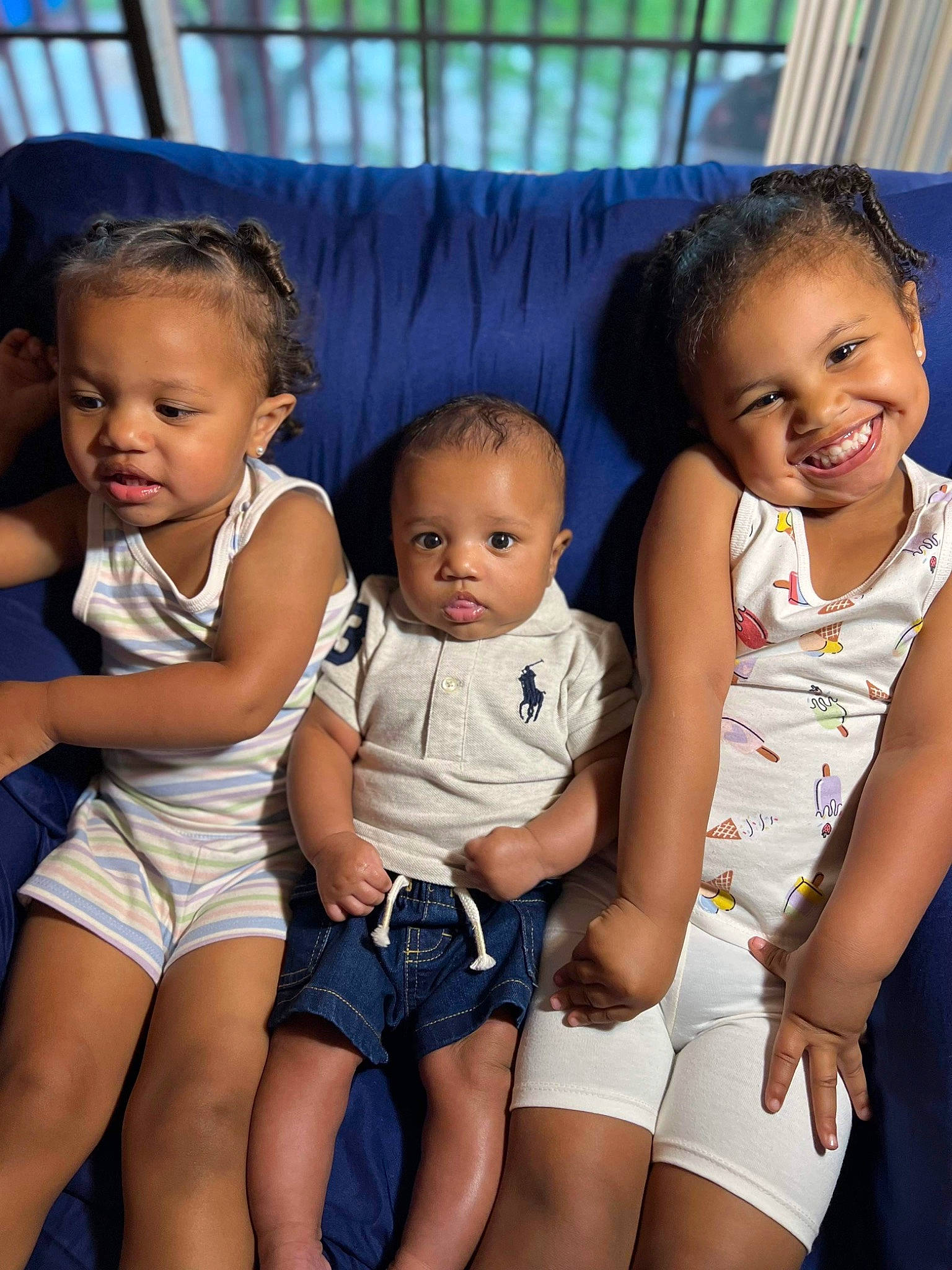 Kamarion joined the competition — help win amazing prizes! baby_toddler_clothing, black, cheek, clothing, face, facial_expression, fashion, gesture, hairstyle, hand, happy, head, human, joy, leg, person, photograph, product, shorts, skin