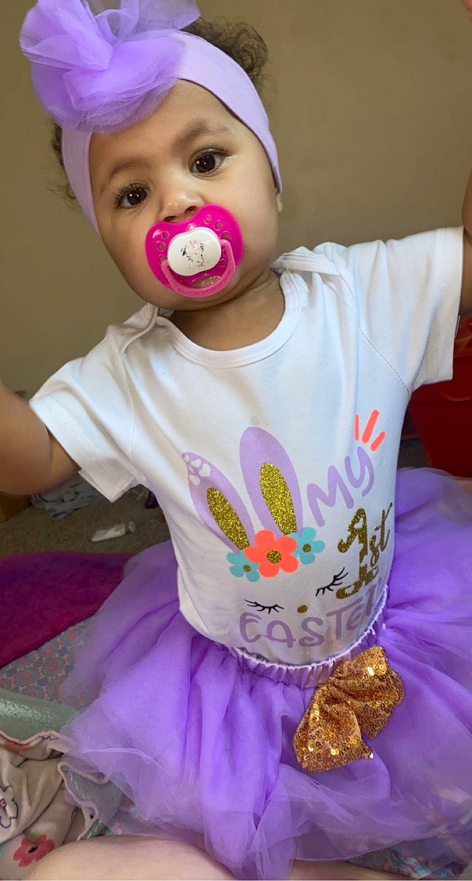 Malayah is registered to the contest to win money with this photo: baby_toddler_clothing, cheek, clothing, eye, eyelash, face, gesture, hair, hairstyle, happy, head, headwear, helmet, lip, nose, person, pink, purple, skin, sleeve