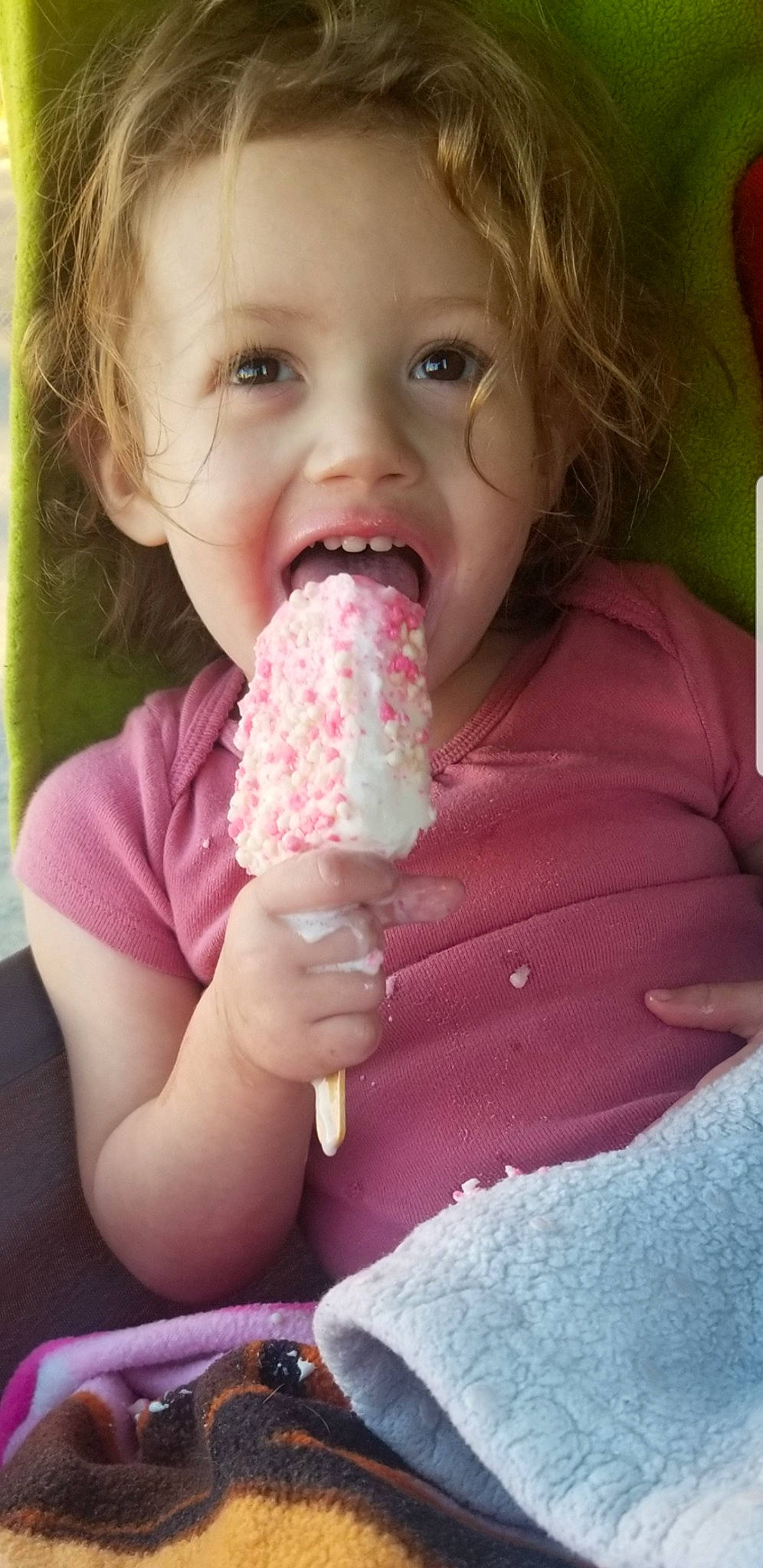 Ella Rose is registered to the contest to win money with this photo: arm, baby, baby_toddler_clothing, cheek, child, dress, eyelash, face, finger, gesture, hand, happy, head, lip, mouth, nose, person, pink, skin, thumb