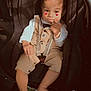 Malone Audet a rejoint le concours — aidez-le/la à gagner de superbes lots ! toddler, car_seat, child, overalls, white_shirt, bow_tie, car_interior, water_bottle, bag, foot, hand, face, cute, sitting, indoor, seatbelt, expression, heart_emoji, clothing, baby