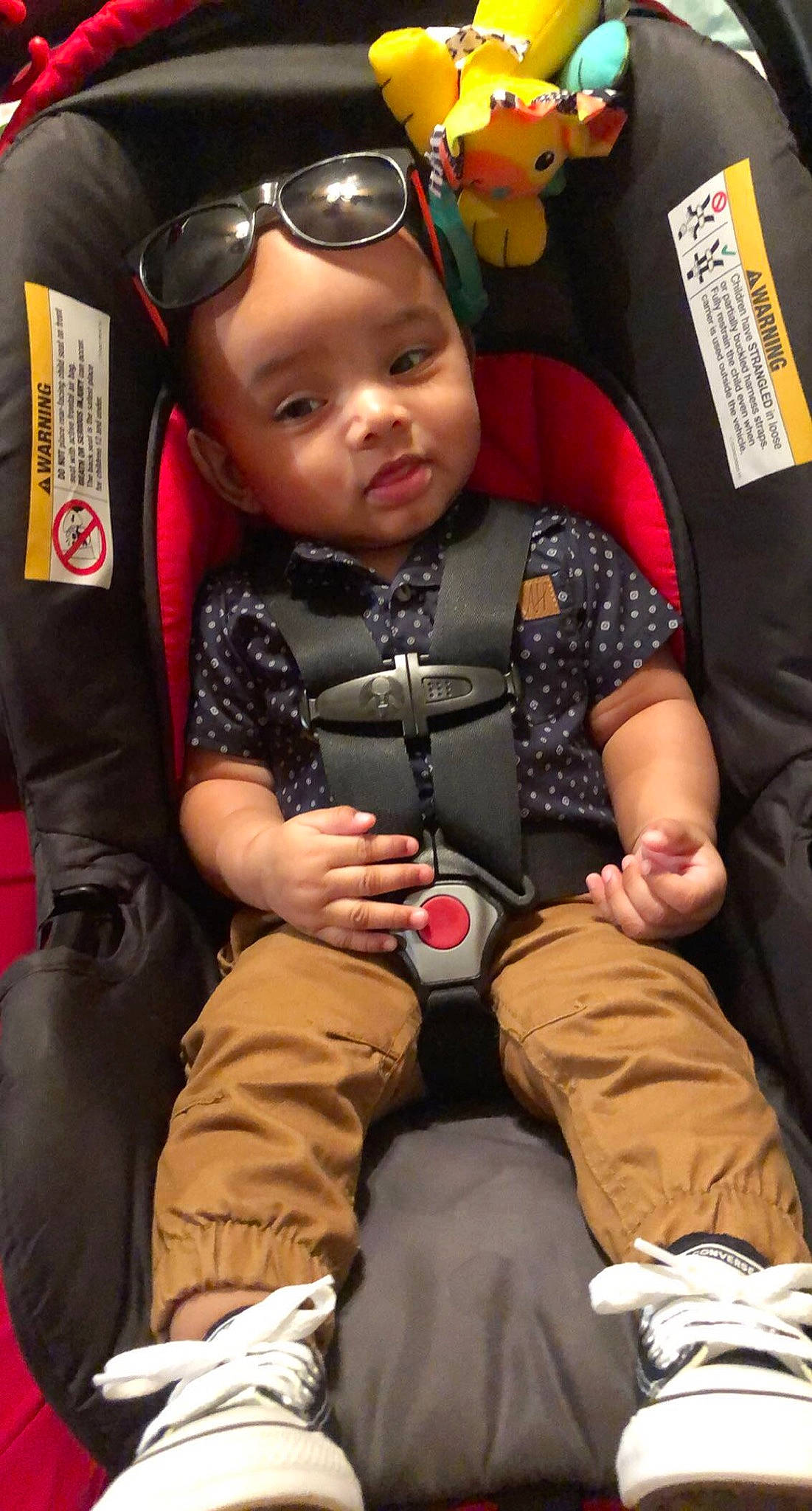 Darius is registered to the contest to win money with this photo: baby, baby_toddler_clothing, cheek, child, comfort, event, fashion, fun, goggles, happy, headwear, human, lap, outerwear, people, person, personal_protective_equipment, sitting, skin, sneakers