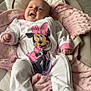 baby, infant, onesie, minnie_mouse, pink_blanket, baby_seat, smiling, happy, indoors, soft_texture, footed_pajamas, child, cute, cozy, person, baby_clothing, newborn, plush_blanket, relaxed, portrait
