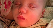 Jaxon joined the competition — help win amazing prizes! apparel, baby, blanket, child, closeup, cozy, cute, fabric, face, hand, indoors, infant, pattern, peaceful, person, portrait, rest, sleeping, soft, warm