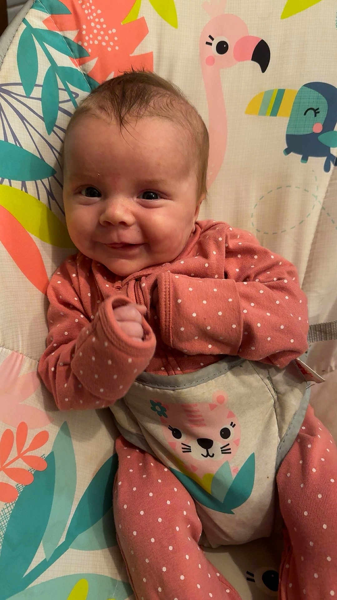 Evie joined the competition — help win amazing prizes! baby, infant, smiling, polka_dot, pink_clothing, blanket, animal_print, cute, face, portrait, child, happy, indoors, sitting, young, person, cozy, soft_fabric, colorful, patterned