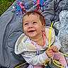baby, infant, child, smiling, happy, outdoor, blanket, grass, headband, patriotic, red_white_blue, party, toy, plush_toy, raccoon, clothing, jacket, pink_pants, pacifier, portrait