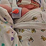 newborn, baby, hospital, medical_tubes, hat, blanket, swaddle, patient, infant, healthcare, cute, sleeping, premature, monitoring, nursery, heart_pattern, hospital_bed, pediatric, soft_fabric, resting