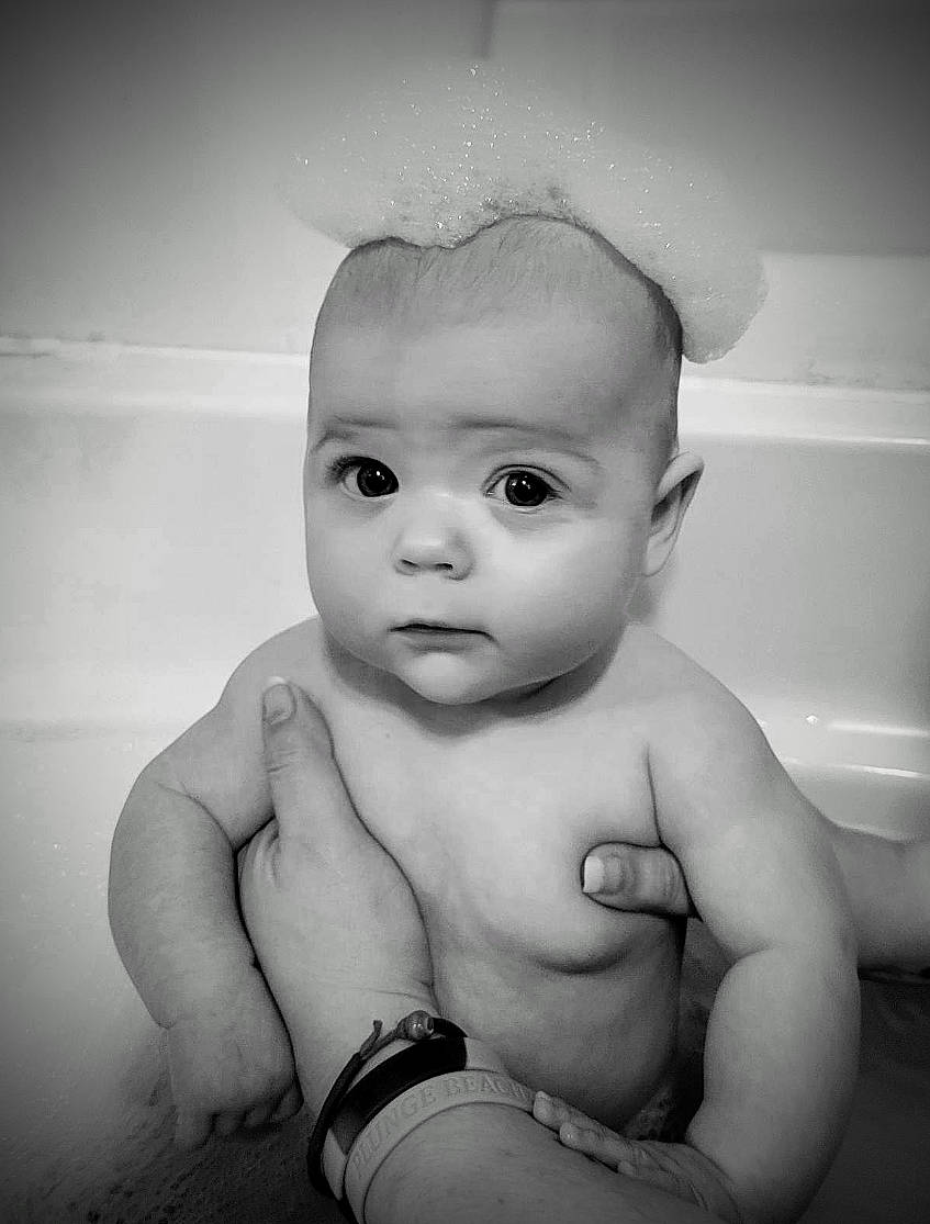 Kenzie joined the competition — help win amazing prizes! arm, baby, black_and_white, cheek, chin, eye, eyebrow, eyelash, finger, flash_photography, forehead, gesture, hand, happy, iris, jaw, lip, nose, person, stomach