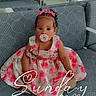 Harmonii is registered to the contest to win money with this photo: child, toddler, baby, portrait, sitting, pacifier, dress, floral_dress, pink_bows, hair_bows, curly_hair, smiling, waiting_room, chairs, indoor, carpet, furniture, patterned_seat, text_overlay, photography