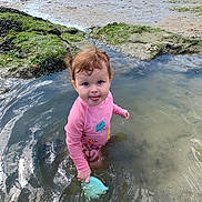 Willow participe au concours pour gagner de l'argent avec cette photo : baby, beach, coast, face, head, mud, nature, outdoors, person, photography, pond, portrait, puddle, rock, sea, shoreline, sitting, soil, summer, water