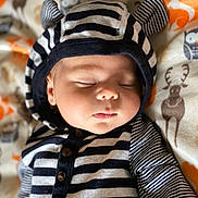 Langston is registered to the contest to win money with this photo: baby, baby_products, baby_toddler_clothing, cheek, child, eyelash, hair_accessory, linens, orange