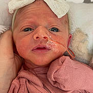 Kayslynn is registered to the contest to win money with this photo: newborn, baby, infant, face, headband, bow, pink_clothing, feeding_tube, medical, closeup, portrait, hand, blanket, soft, resting, cute, skin, young_child, indoors, comfort