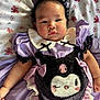 Ingsy is registered to the contest to win money with this photo: baby, child, purple_dress, headband, cat_ears, pearls, floral_blanket, cute, infant, portrait, indoors, costume, lace, ribbons, plush, soft_toys, person, chubby_cheeks, lying_down, calm_expression