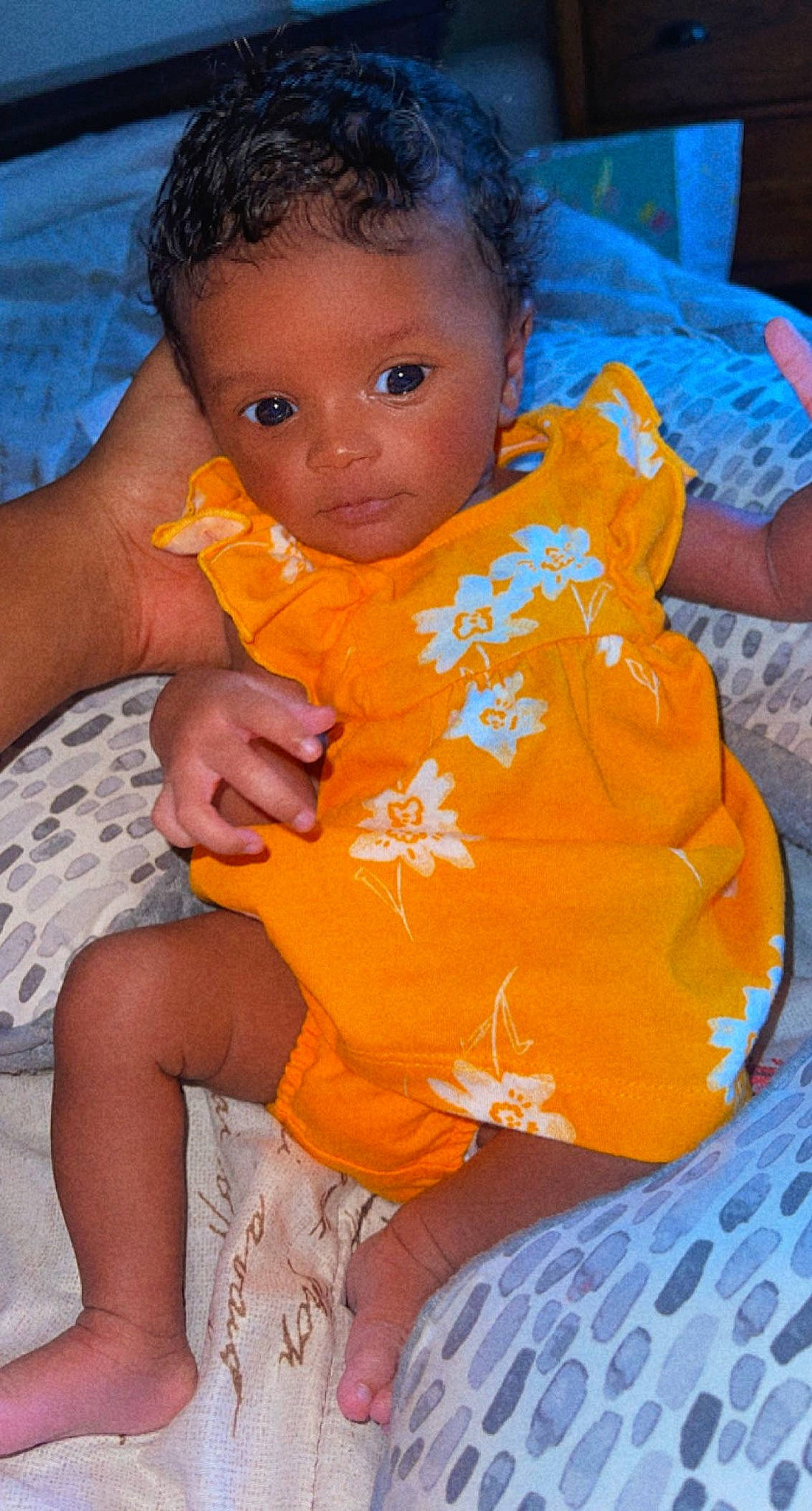 Londyn is registered to the contest to win money with this photo: baby, baby_toddler_clothing, blue, chair, cheek, child, dress, fun, hair, hairstyle, happy, mouth, nail, nose, orange, person, sitting, skin, t_shirt, thigh