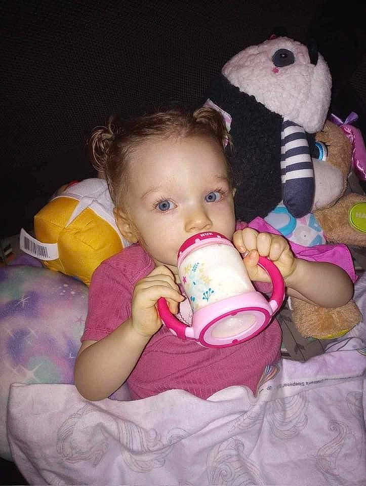 Nova is registered to the contest to win money with this photo: arm, baby, baby_toddler_clothing, cheek, child, comfort, eye, finger, hand, happy, human_body, iris, mouth, nail, nose, person, pink, product, skin, textile