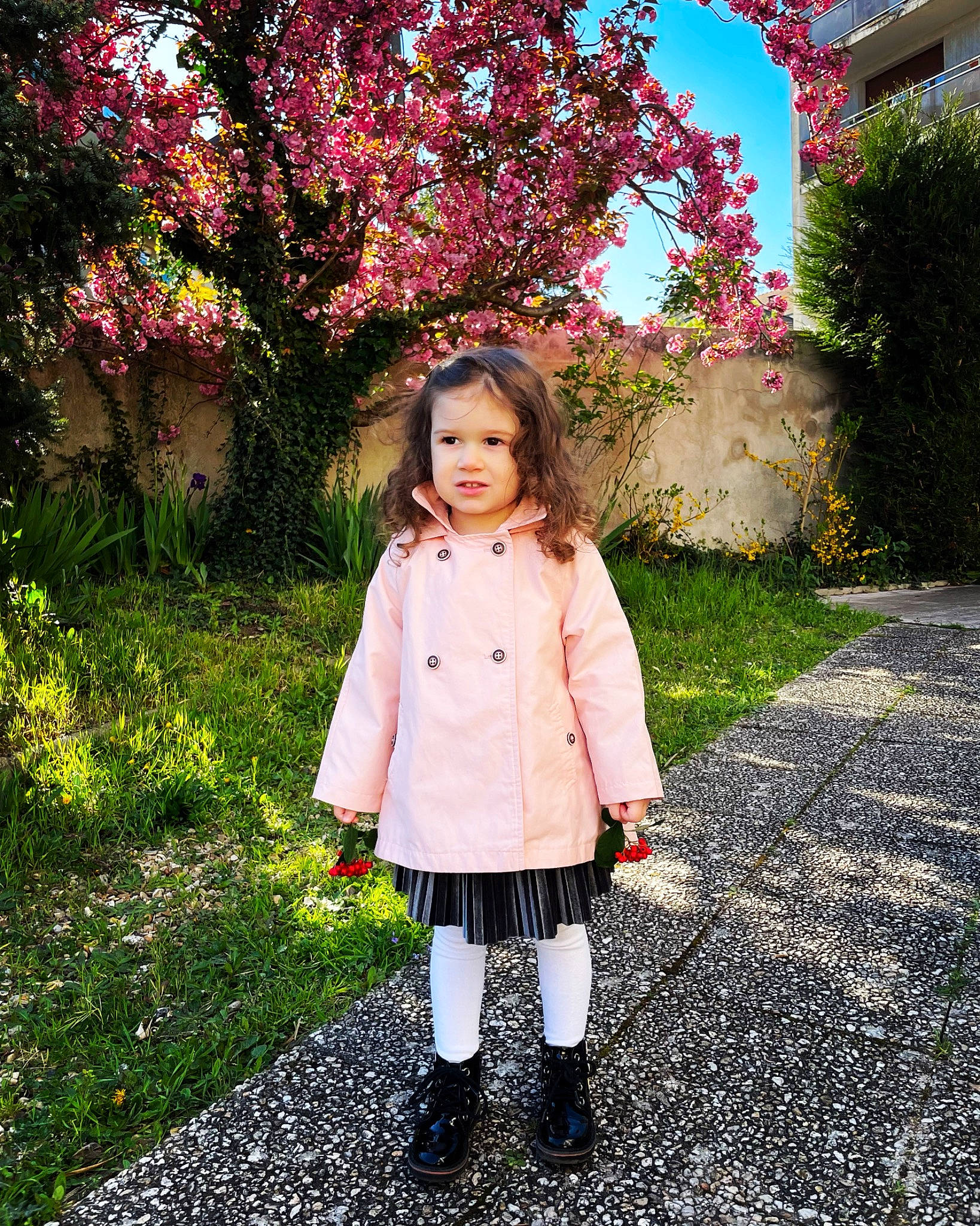 Victoria participe au concours pour gagner de l'argent avec cette photo : boot, botany, clothing, flower, fur, garden, grass, happy, head, leisure, magenta, pattern, people_in_nature, person, pink, plant, sleeve, sneakers, spring, toddler