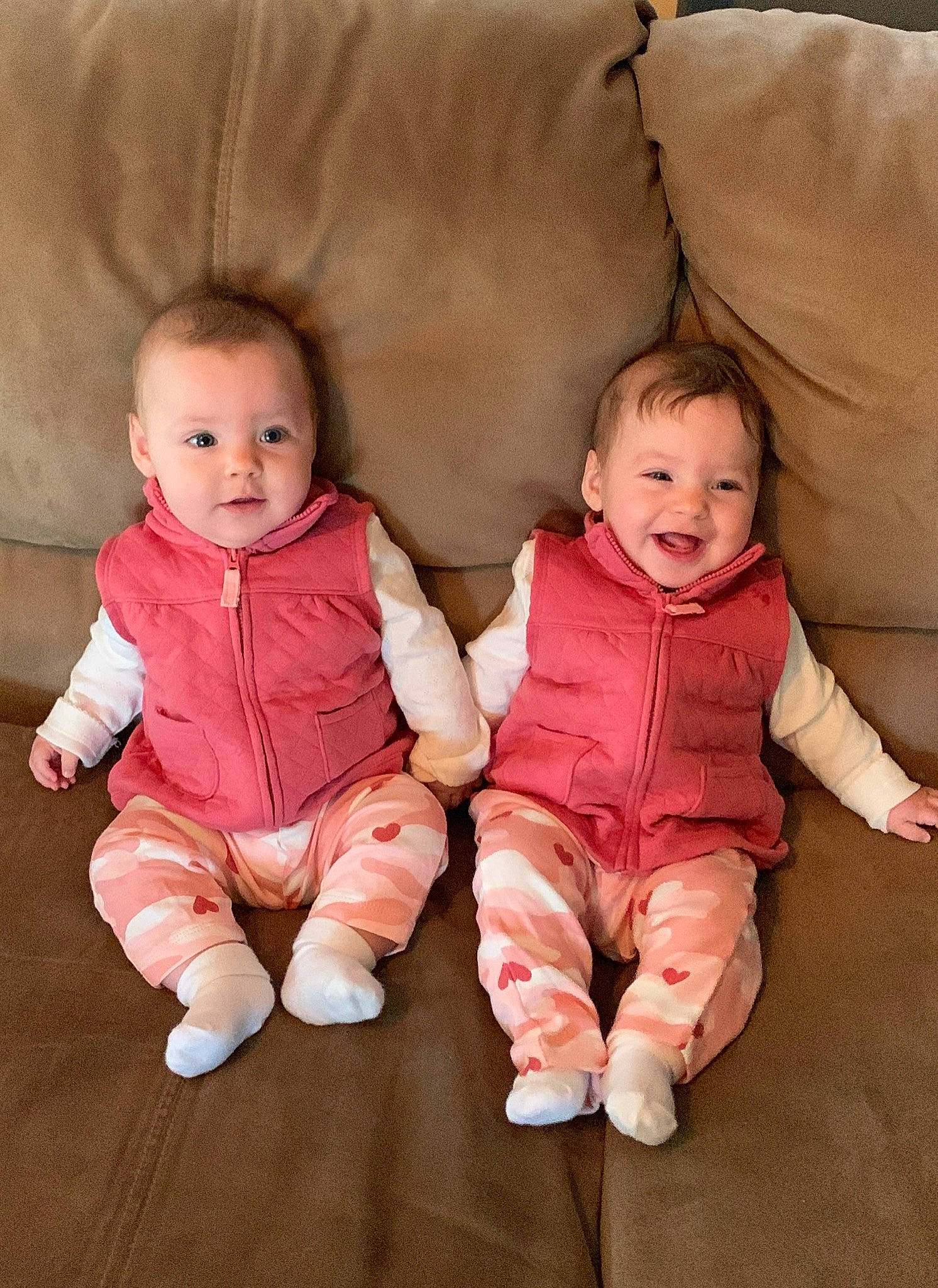 Ruth is registered to the contest to win money with this photo: baby, baby_toddler_clothing, cheek, chin, comfort, eye, face, facial_expression, gesture, happy, head, human_body, iris, joy, nose, person, pink, product, skin, sleeve