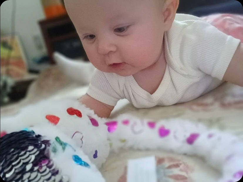 Emersyn is registered to the contest to win money with this photo: baby, baby_toddler_clothing, cheek, clothing, comfort, eyebrow, face, facial_expression, head, headwear, iris, lip, mouth, nose, person, photograph, pink, skin, sleeve, textile