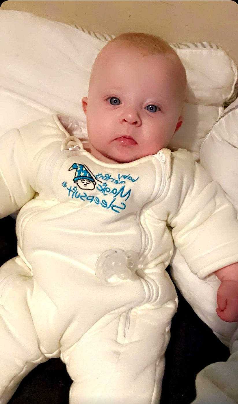 Emersyn is registered to the contest to win money with this photo: baby, baby_toddler_clothing, cheek, chest, child, chin, comfort, eye, eyebrow, face, happy, human_body, iris, linens, lip, nose, person, skin, sleeve, smile