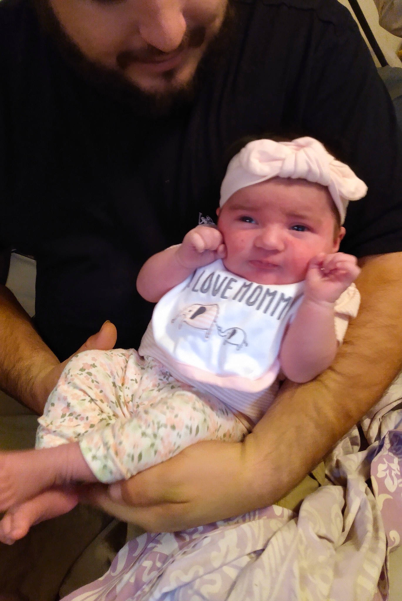 Adelyn is registered to the contest to win money with this photo: baby, baby_products, baby_toddler_clothing, cheek, child, comfort, event, finger, fun, gesture, hand, happy, hat, headwear, human, human_body, lap, person, sitting, skin