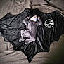 Wyatt is registered to the contest to win money with this photo: baby, sleeping, onesie, hat, blanket, bat_wing, milestone, pacifier, infant, cute, cozy, black, fabric, lying_down, newborn, portrait, soft_lighting, indoors, resting, baby_photography