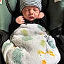 baby, newborn, sleeping, hat, striped_hat, blanket, car_seat, infant, child, cozy, cute, peaceful, toddler, clothing, indoor, portrait, baby_clothes, bundle, resting, seat