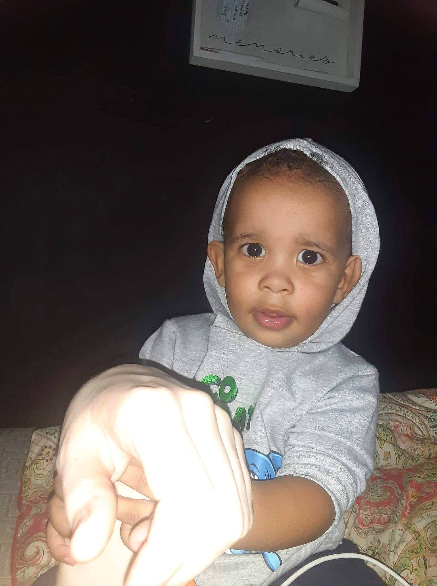 Ethan is registered to the contest to win money with this photo: baby, baby_products, baby_toddler_clothing, cheek, child, comfort, ear, elbow, eye, finger, flash_photography, gesture, hairstyle, nail, person, sitting, skin, smile, thumb, toddler