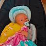 Maddox is registered to the contest to win money with this photo: baby, blanket, pacifier, child, infant, cushion, seat, indoor, colorful, pattern, cute, comfort, resting, pink, blue, yellow, polka_dot, peaceful, small_hand, wrapped