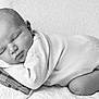 Arthur participe au concours pour gagner de l'argent avec cette photo : baby, newborn, sleeping, infant, pillow, blanket, black_and_white, peaceful, cute, face, hand, cozy, soft, portrait, closeup, child, resting, indoors, monochrome, sleep