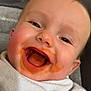 baby, cheeks, child, closeup, cute, expression, eyes, face, feeding, food, happy, highchair, infant, messy, mouth, portrait, sauce, skin, smile, towel