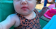 Nova is registered to the contest to win money with this photo: arm, baby, backyard, chair, child, eyes, face, family_gathering, head, infant, leopard_print, outdoor, patterned_clothing, photography, poolside, portrait, sitting, summer, turquoise, wide_eyed