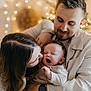 baby, yawning, family, mother, father, love, warm_lighting, indoors, cozy, holding, portrait, happy, cute, parenthood, affection, smiling, casual_clothing, watch, hair, skin