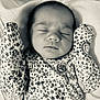 Lillian is registered to the contest to win money with this photo: baby, bed, blanket, bodypart, bonnet, clothing, cushion, face, finger, furniture, glove, hand, hat, head, homedecor, newborn, person, photography, portrait, sleeping