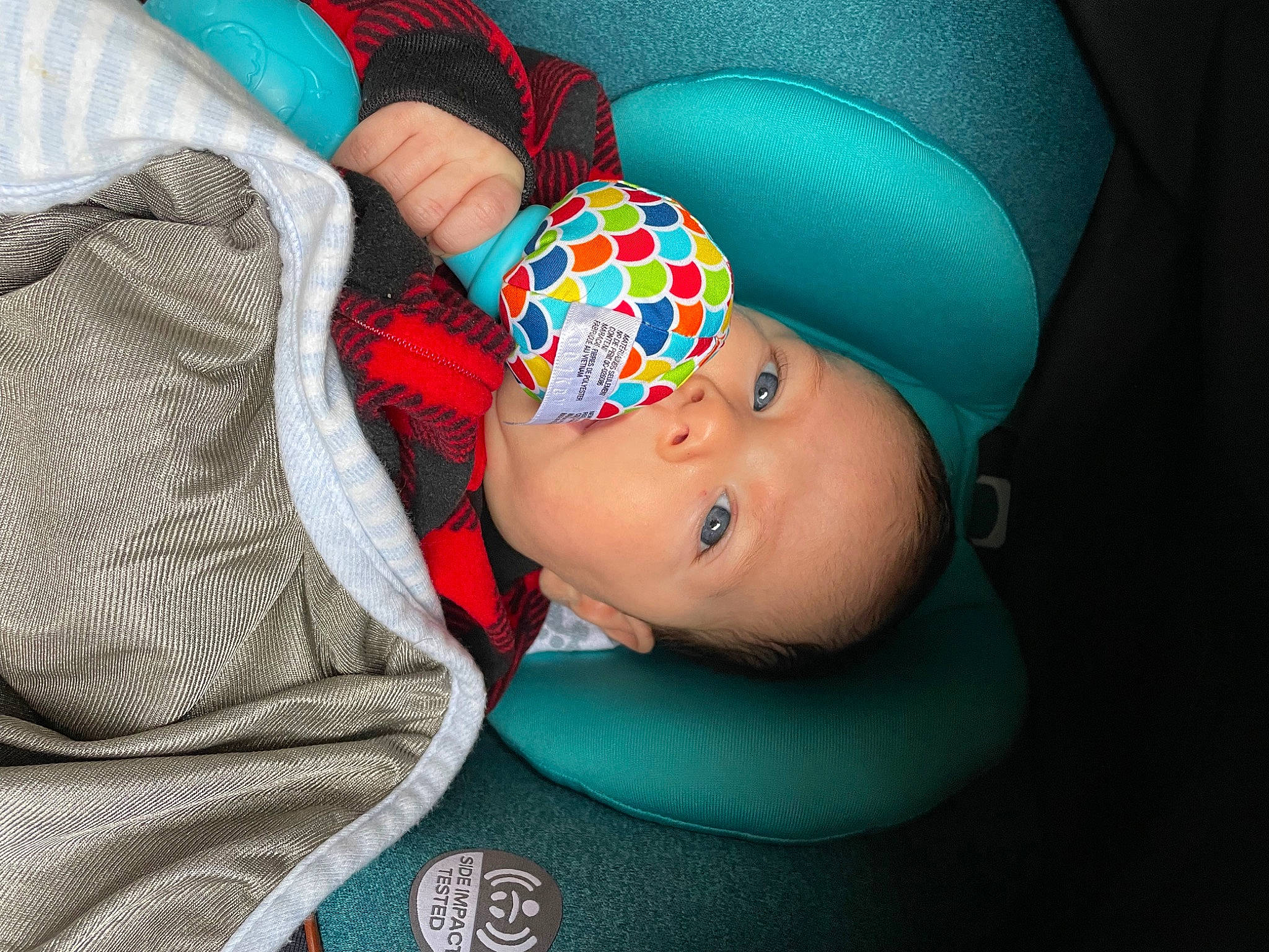 Mark is registered to the contest to win money with this photo: baby, baby_products, baby_toddler_clothing, beanie, cap, cheek, child, comfort, electric_blue, fashion_accessory, knit_cap, linens, nap, pattern, person, plaid, sitting, sleep, sleeve, toddler