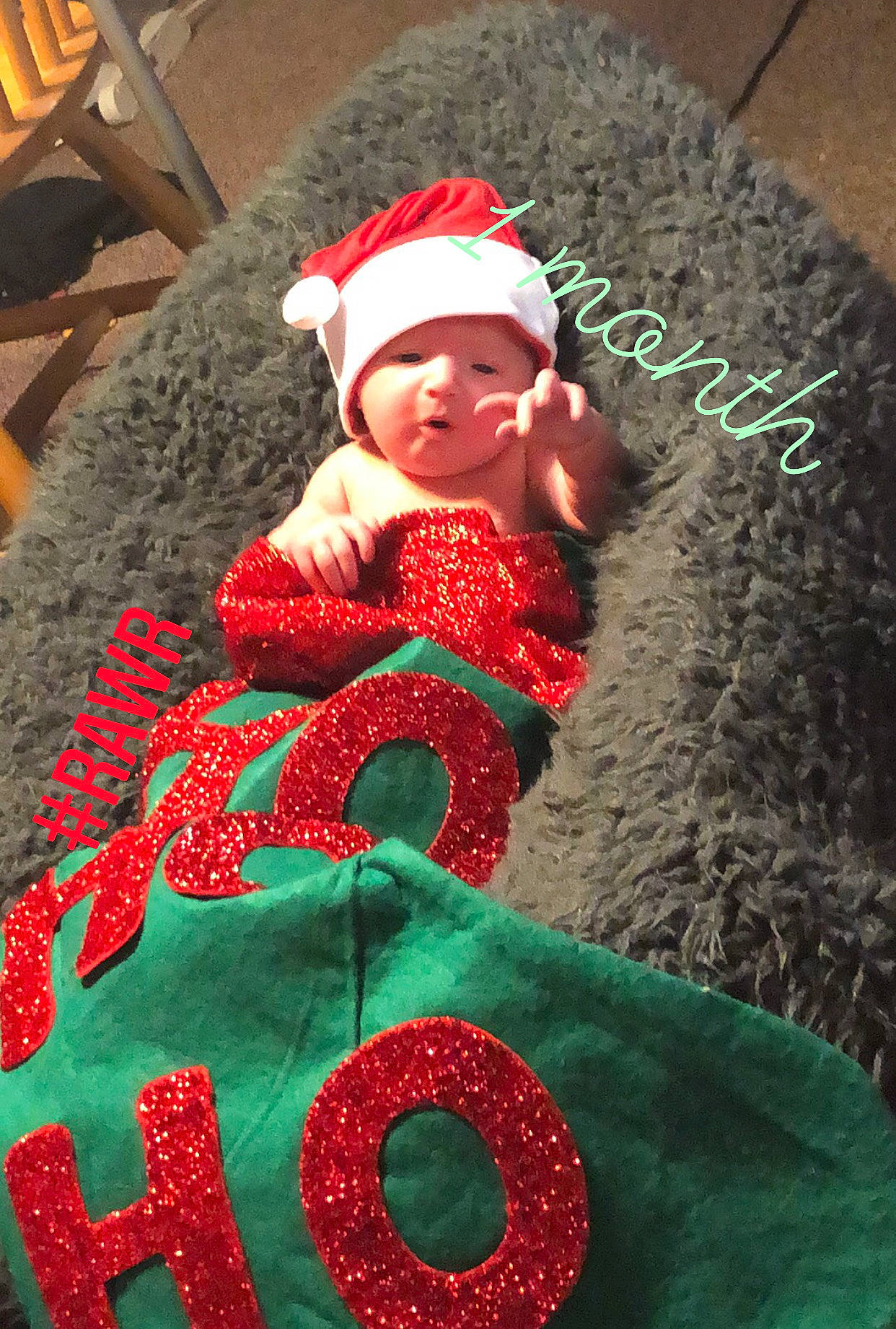 Allyson is registered to the contest to win money with this photo: baby, baby_toddler_clothing, cap, carmine, christmas, christmas_eve, event, green, head, headwear, holiday, linens, magenta, outerwear, pattern, person, red, textile, toddler, tree