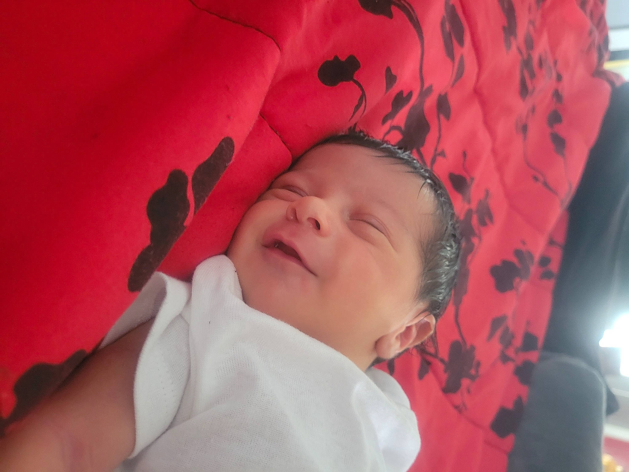 Bruce is registered to the contest to win money with this photo: baby, carmine, cheek, child, comfort, finger, happy, human, linens, lip, magenta, mouth, nose, person, pink, product, skin, sleeve, smile, textile