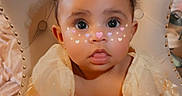 Saphira joined the competition — help win amazing prizes! baby, child, infant, portrait, sitting, chair, indoors, home, easter, bunny_ears, face_filter, heart_stickers, sparkles, wide_eyes, curly_hair, dress, couch, furniture, smiling, text_overlay