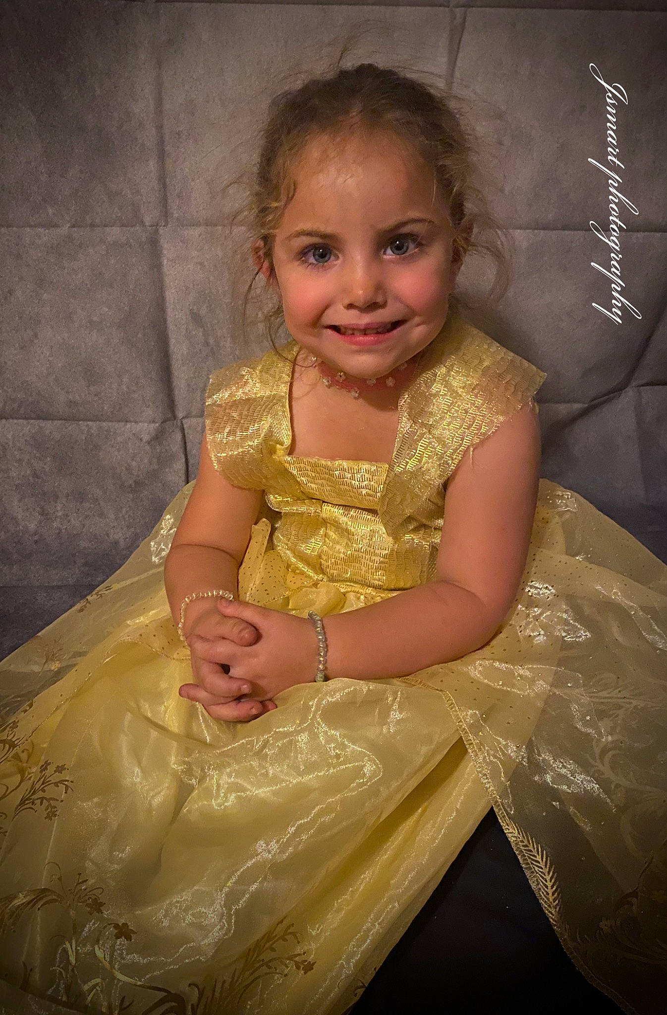 Rayna is registered to the contest to win money with this photo: baby_toddler_clothing, child, child_model, clothing, day_dress, dress, embellishment, facial_expression, hairstyle, iris, joy, laugh, one_piece_garment, person, ruffle, toddler, yellow