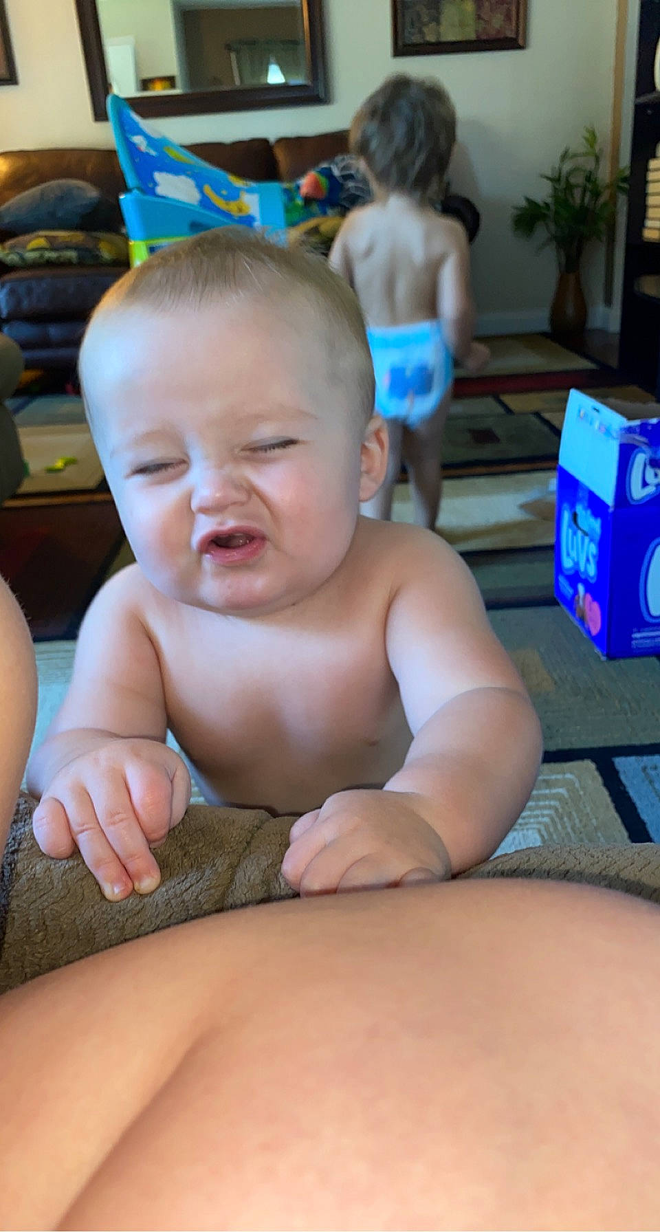 Joziah is registered to the contest to win money with this photo: baby, blue, cheek, chin, eye, facial_expression, hair, hairstyle, head, human_body, joint, leg, mouth, muscle, neck, organ, person, shoulder, skin, standing