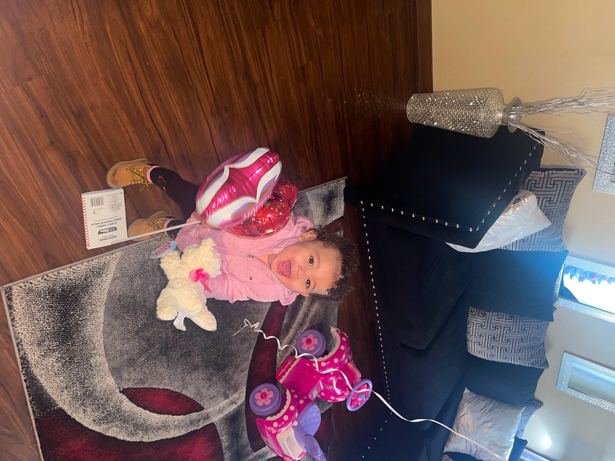 Khalena is registered to the contest to win money with this photo: carmine, doll, hardwood, magenta, office_equipment, person, pink, plastic_bag, room, toy, wood