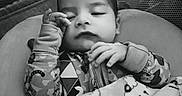 Kyren joined the competition — help win amazing prizes! baby, blanket, child, comfort, cozy, cute, face, hand, indoors, infant, mesh_background, monochrome, patterned_clothing, peaceful, portrait, resting, sleeping, soft_texture, toddler, young