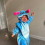 Hans joined the competition — help win amazing prizes! blue, carpet, child, costume, cute, door, ears, fun, happy, hood, indoor, light, motion, person, pink, playful, shadow, smiling, toddler, wall