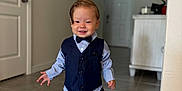 Hans joined the competition — help win amazing prizes! bow_tie, boy, carpet, child, door, face, floor, hair, hallway, indoor, pants, photographs, shirt, shoes, smiling, suit, toddler, walking, wall, white_sneakers